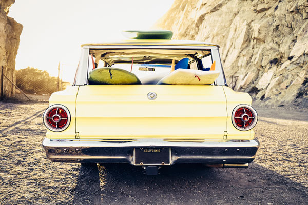 Premium photographer example: Vintage station wagon at beach